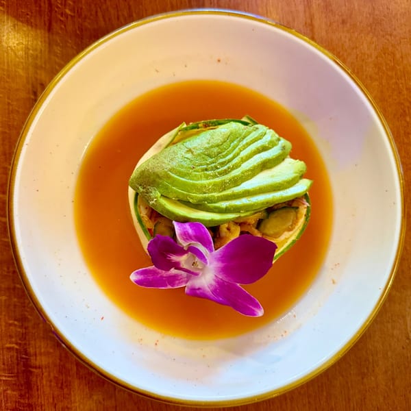 Aguachile with avocado and orchid in red broth
